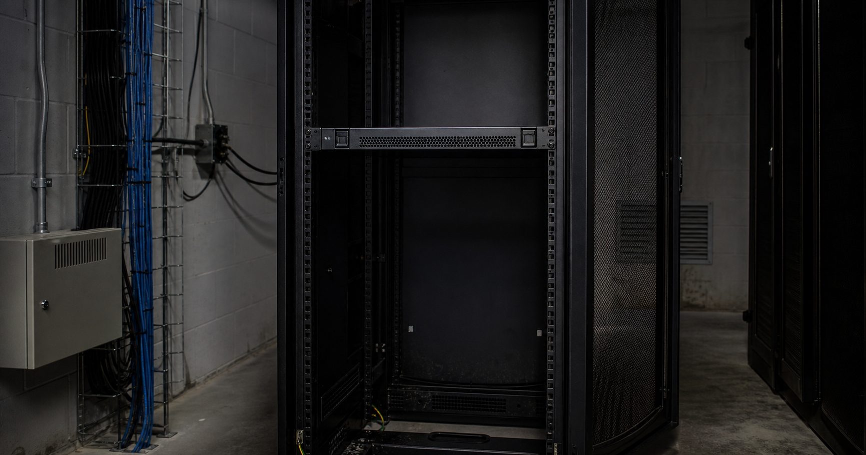 A dimly lit server room corner with a powered-off 1U server and a sticky note reading 'AS212022 – Link-Life LLC' in faded ink, illuminated by a wall display showing the RDAP record from RIPE NCC.