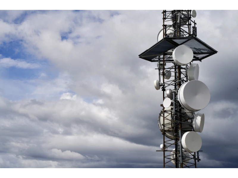 telecommunications-towers-against-cloudy-sky